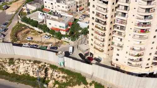 Security wall with Israeli idf watch tower Close to Shuafat Refugee Camp- Aerial
