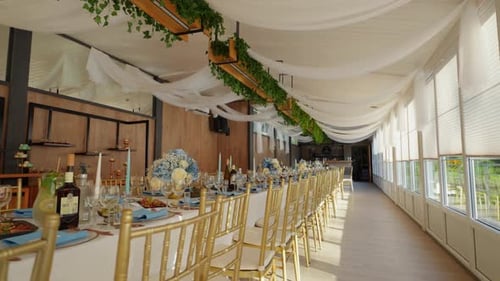 shot of luxury dining-table for an wedding occasion in the indoor restaurant area with a garden view