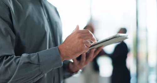 Man Touching Tablet in Modern Office