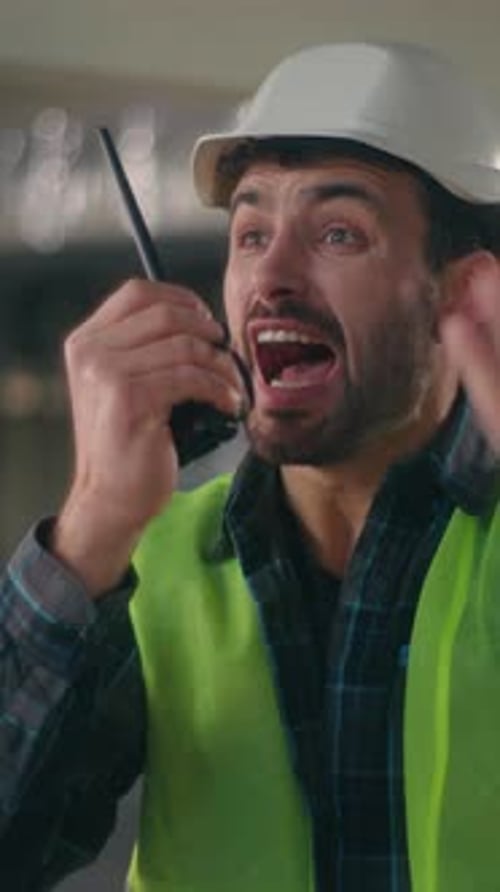 Angry Caucasian Man Talking Shouting Scream on Walkie Talkie Radio Device Furious Male Contractor
