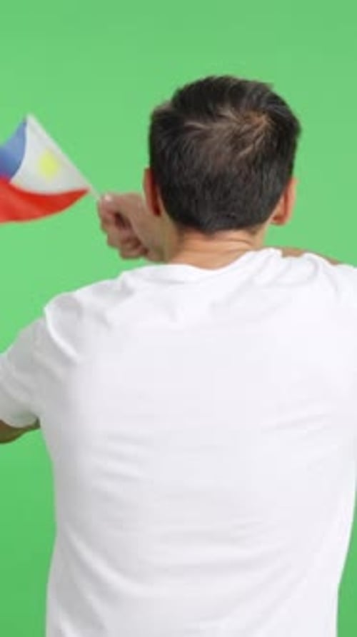 Rear View of a Man Waving a Philippine Pennant