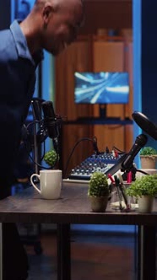 Vertical Video Cohosts Arriving in Studio Ready to Stream Podcast Using Professional Vlogging