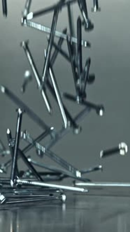 Nails Fall on a Metal Table Filmed on a Highspeed Camera at 1000 Fps