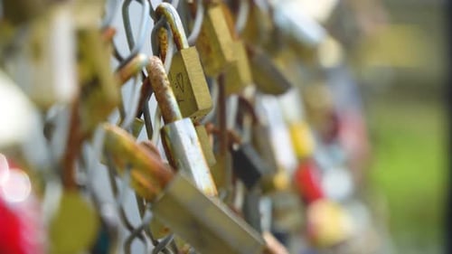 Close-Up of Love Locks on Chain-Link Fence