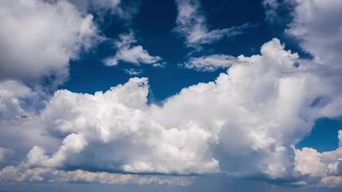 Clouds timelapse. Cumulonimbus clouds forming in the summer sky. Aerial timelapse of the sky with fo