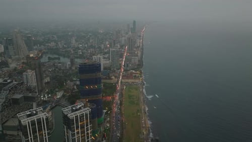 Forwards Fly Above Sea Coast Heavy Traffic on Multilane Road Leading Through Urban Borough with