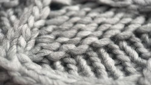 Detailed Macro Shot of Knitted Grey Wool Fabric