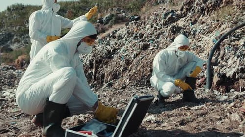Scientists Examining Trash at Landfill
