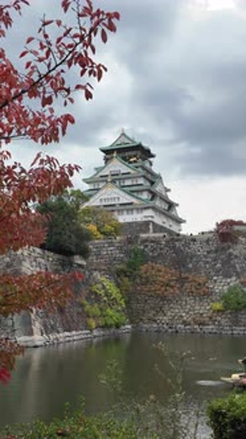 Osaka Castle Surrounded By Moat and Autumn Foliage