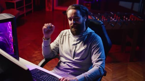 Professional Gamer in Studio Teaching Viewers Strategies to Beat Opponents During Livestream