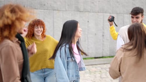 Multiethnic Friends Enjoying Dancing and Celebrating Together in the City