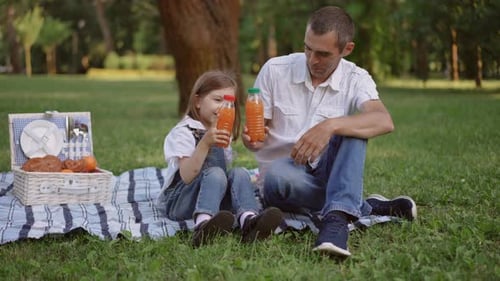 Enjoying a Lovely Picnic in the Park is a Great Way to Spend Quality Time with Family and Friends