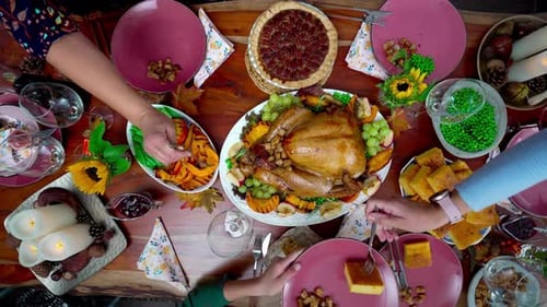 Overhead View of Thanksgiving Dinner Table Being Served