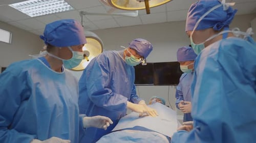 Surgeons Perform Operation in Hospital Operating Room
