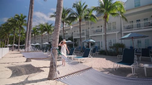 A Woman Enjoying a Leisurely Walk at a Stunning Hotel in Key West Florida