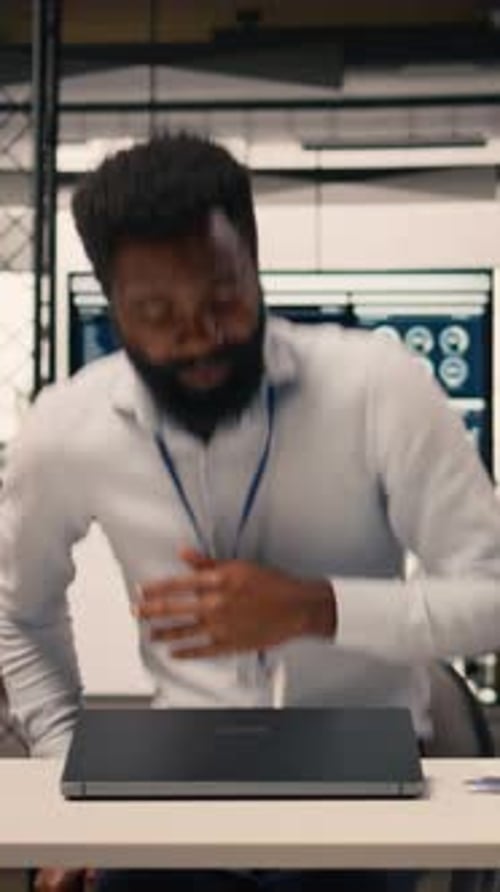 Vertical Video Black Employee Analyzing Charts and Graphs During Strategic Planning Session