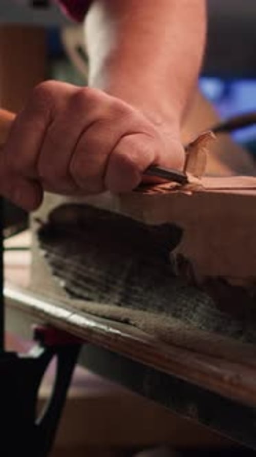 Vertical Video Woodworking Professional in Studio Shaping Wooden Pieces Close Up