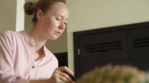 Woman Prepares Food, Stirring Mixture with a Spoon