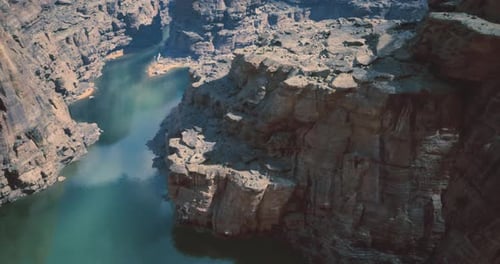 Stunning View of Rocky Cliffs and Tranquil Waters in a Remote Canyon Area
