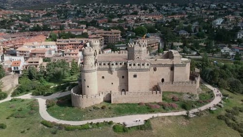 A near shot of a castle from a drone