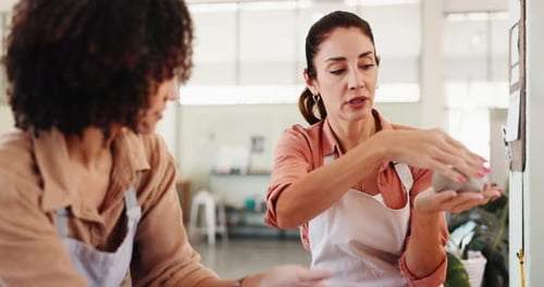 Woman, instructor and molding clay for pottery with sculpture design, learning technique