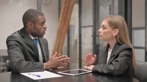 Professional Man and Woman Meeting at Office Table