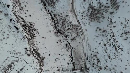 Stunning Aerial Winter Landscape with Serene Snowy River