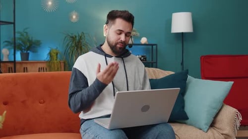 Young Man Freelance Worker Call Center or Support Service Operator Helpline Having Talk with Client