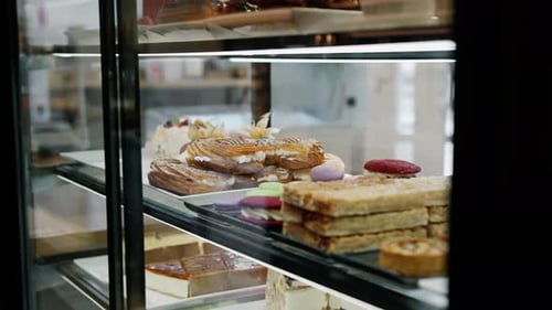 Counter full of delicious buns and pastries in a shop, bakery