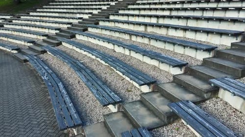 Rustic Wooden Bleachers Of Sun Hill Open-Air Stage In The Town Of Talsi, Latvia. Pullback Shot