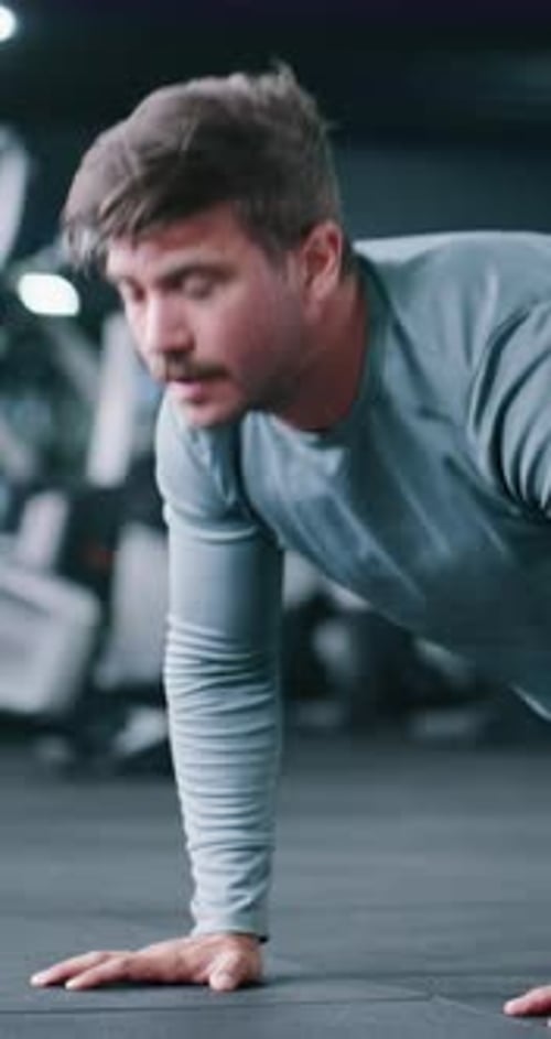 Fitness, push up or man in center with workout, power or cardio strength in endurance training
