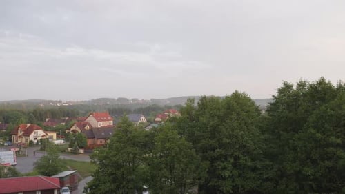 Gray clouds moving over Kolbudy village in pomeranian district.
