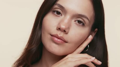 Beautiful Young Woman Touching Face Skin Care Concept