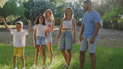 Happy Family Playing Together in a Sunny Park
