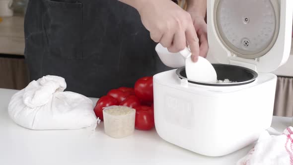man cooking rice using Electric rice cooker, Food Stock Footage ft ...