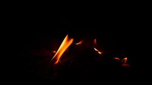 Fire burning lowly in dark background