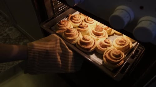 Cinnamon Rolls Baking Inside of Oven