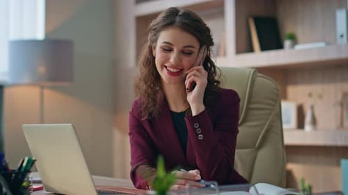Professional Woman Working at Desk Using Technology