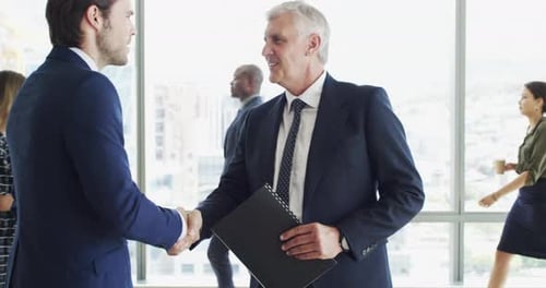 Business Handshake in Modern Urban Office Setting