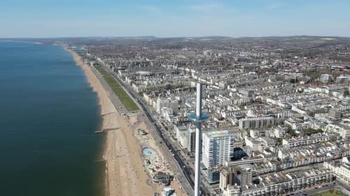 Brighton UK British Airways i360, Pov beach and tower Aerial 4K.