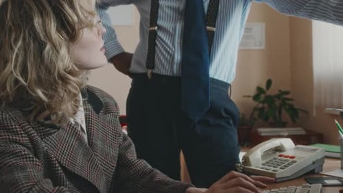 Director Talking to Positive Secretary in Retro Office