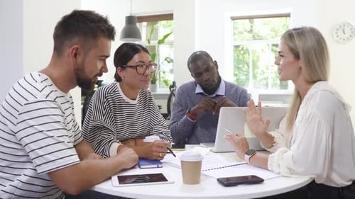 Diverse Team Brainstorming in Bright Modern Office
