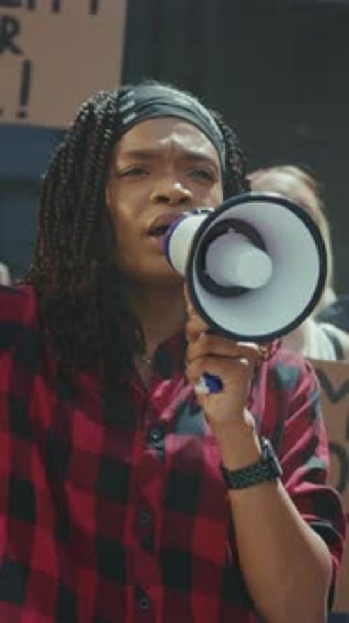 Empowering Female Leader Determined Woman Speaks Through Loudspeaker to Inspire Solidarity and