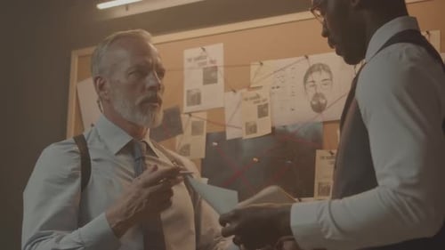 Police Detectives Discussing Criminal Case in Office at Night