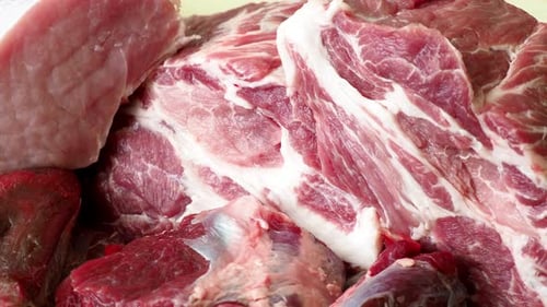 Raw pork meat on wooden table