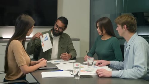 Office Conference Meeting Male Chief Coach Businessman Talking to Multiracial Business Team Showing