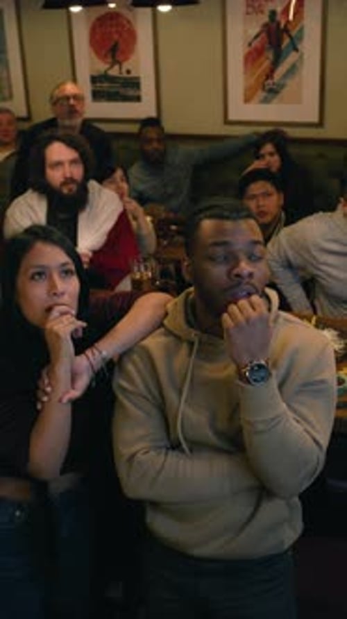 Friends Watching a Game at the Pub