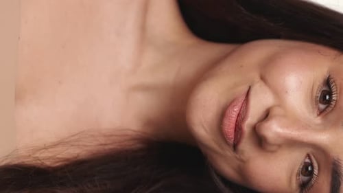 Smiling Young Woman with Long Brown Hair