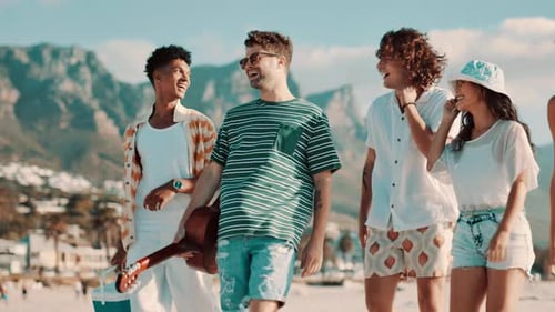 Friends, picnic and walking on beach for travel with basket, conversation or wind for vacation