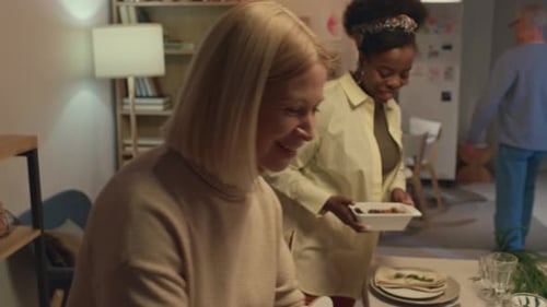 Family and Friends Preparing Festive Meal at Home